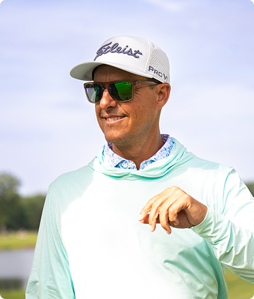 Parker McLachlin speaking on a practice green